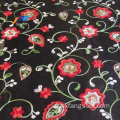 Robe de femme de broderie de fleur de Tokay africaine en tissu noir